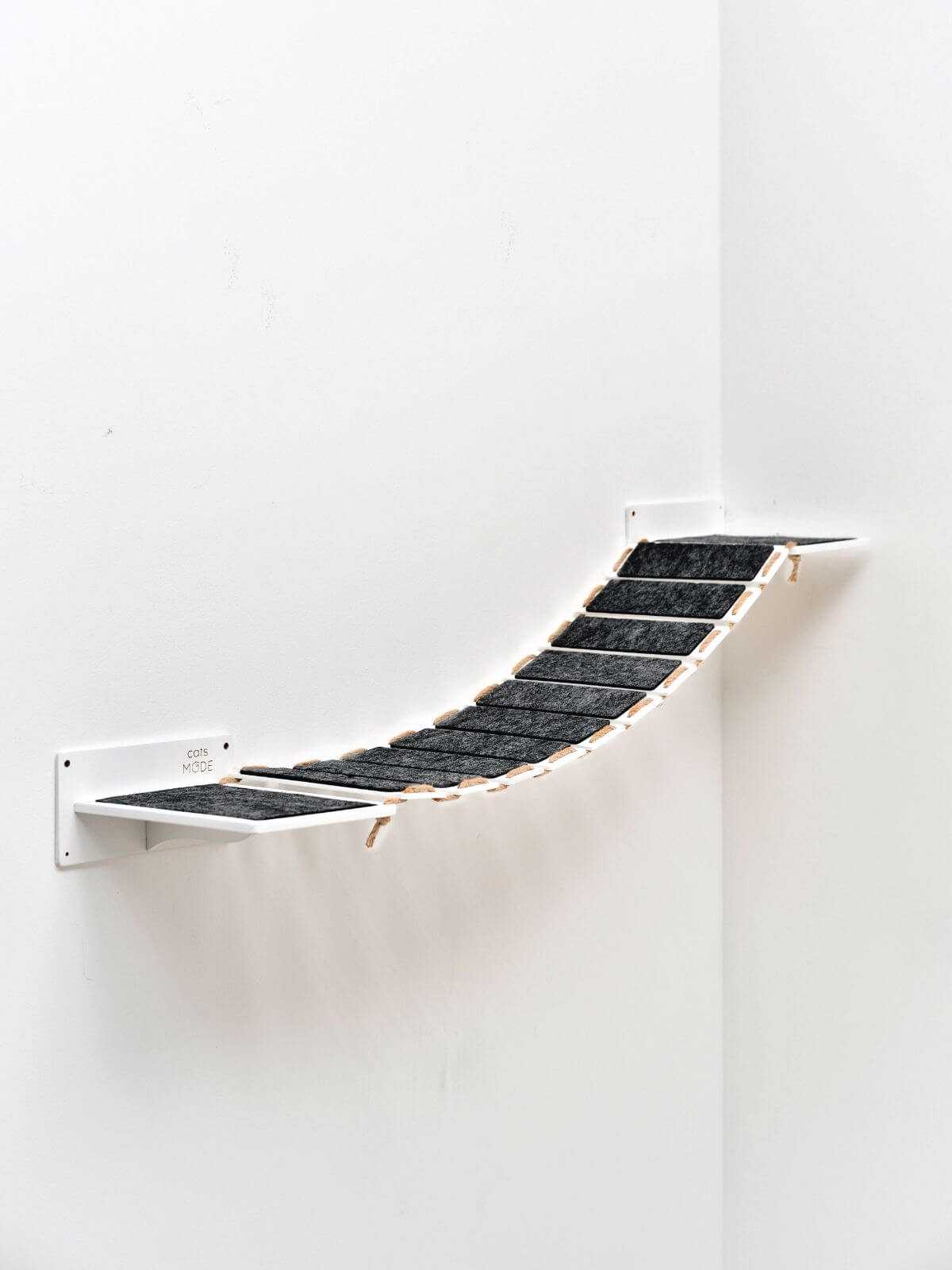 elevated cat walkway in white color covered with black felt
