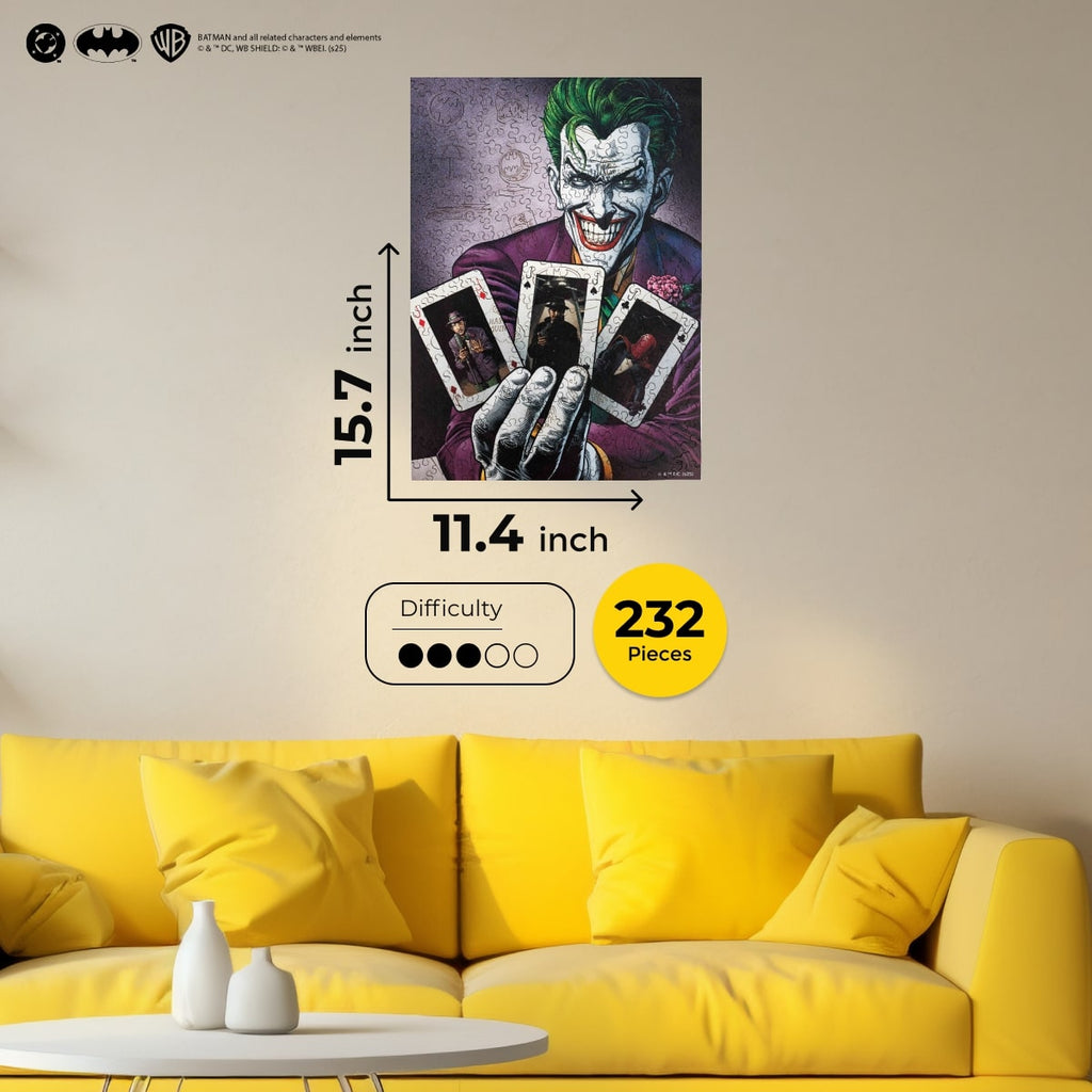 Joker poster on a wall above a yellow sofa with puzzle piece details.