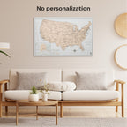 Living room with a white sofa, wooden coffee table, and framed map of the United States on the wall.