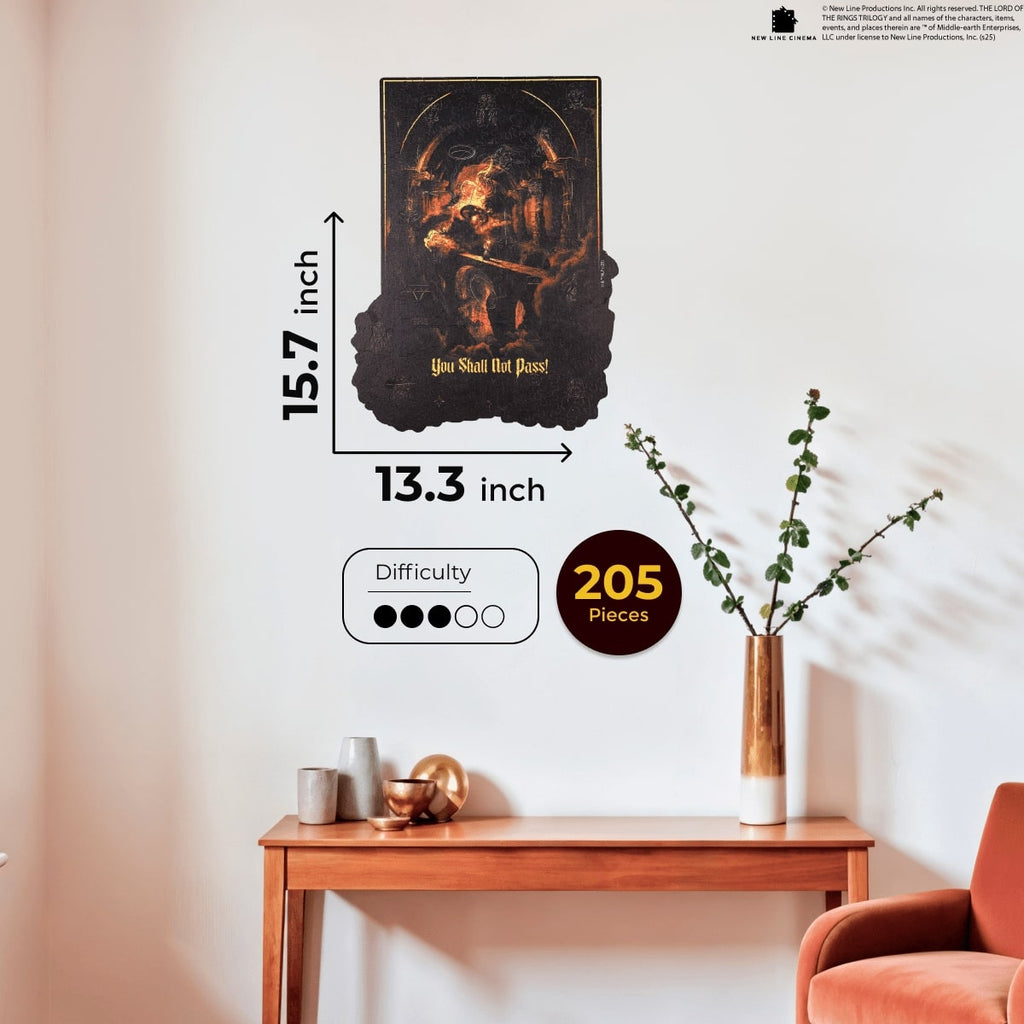 Wall art piece with measurements and difficulty rating on a wall above a wooden table and chair.