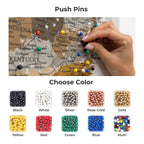 Map with push pins and hand placing a pin, surrounded by color swatches for push pins.