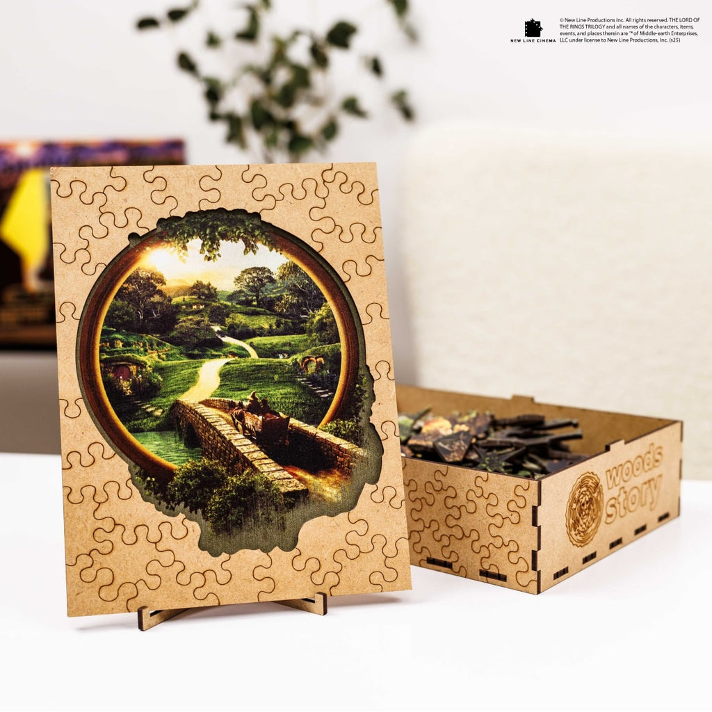 Wooden puzzle with scenic design and packaging on a white surface