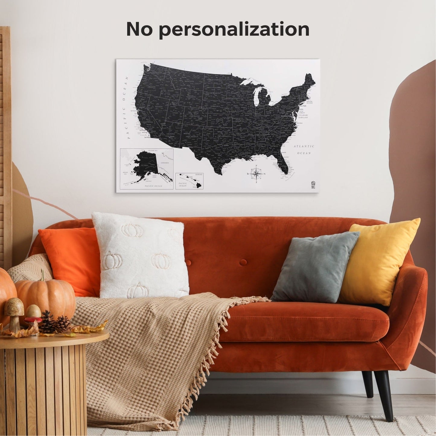 Living room with an orange sofa, colorful pillows, and a map of the United States on the wall.