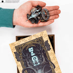 Hand holding puzzle pieces above a partially completed puzzle with a decorative cover.