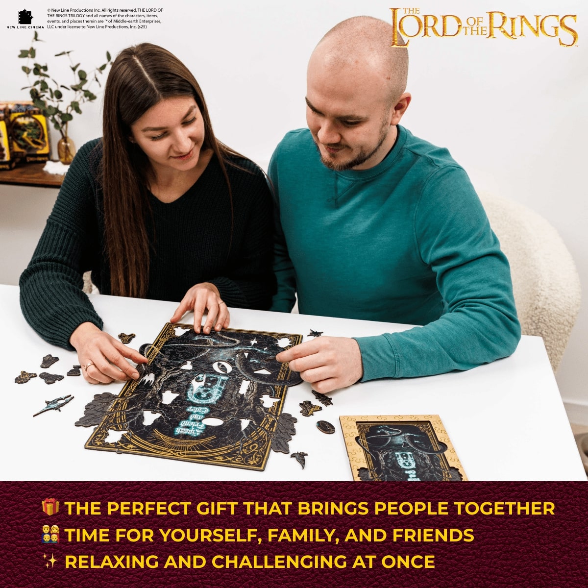 Two people working on a puzzle together with 'The Lord of the Rings' branding.