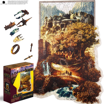 Living room with a gray sofa, brown chair, and a wall art piece depicting a scenic landscape.