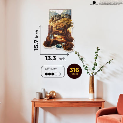 Living room with a gray sofa, brown chair, and a wall art piece depicting a scenic landscape.