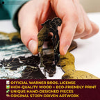 Hand assembling a puzzle piece with text about Warner Bros. license and product details.