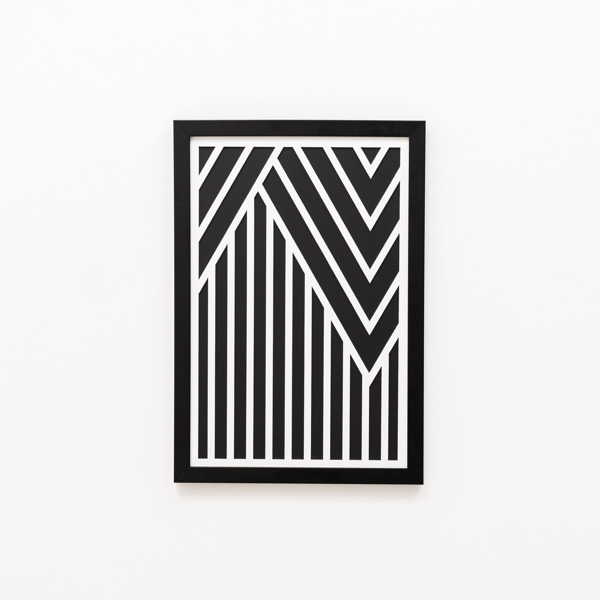 Framed black and white geometric art on a white background