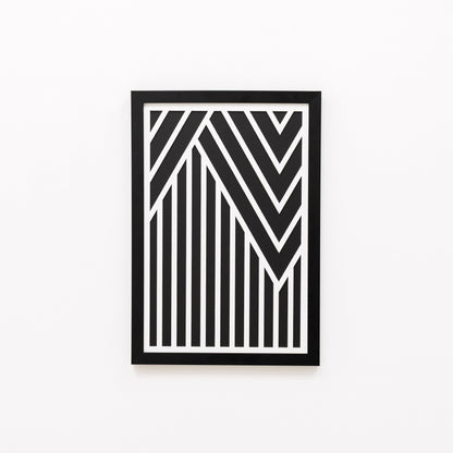 Framed black and white geometric art on a white background