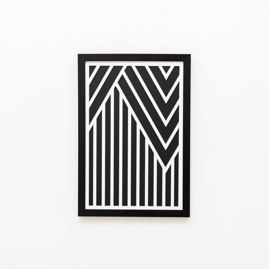 Framed black and white geometric art on a white background
