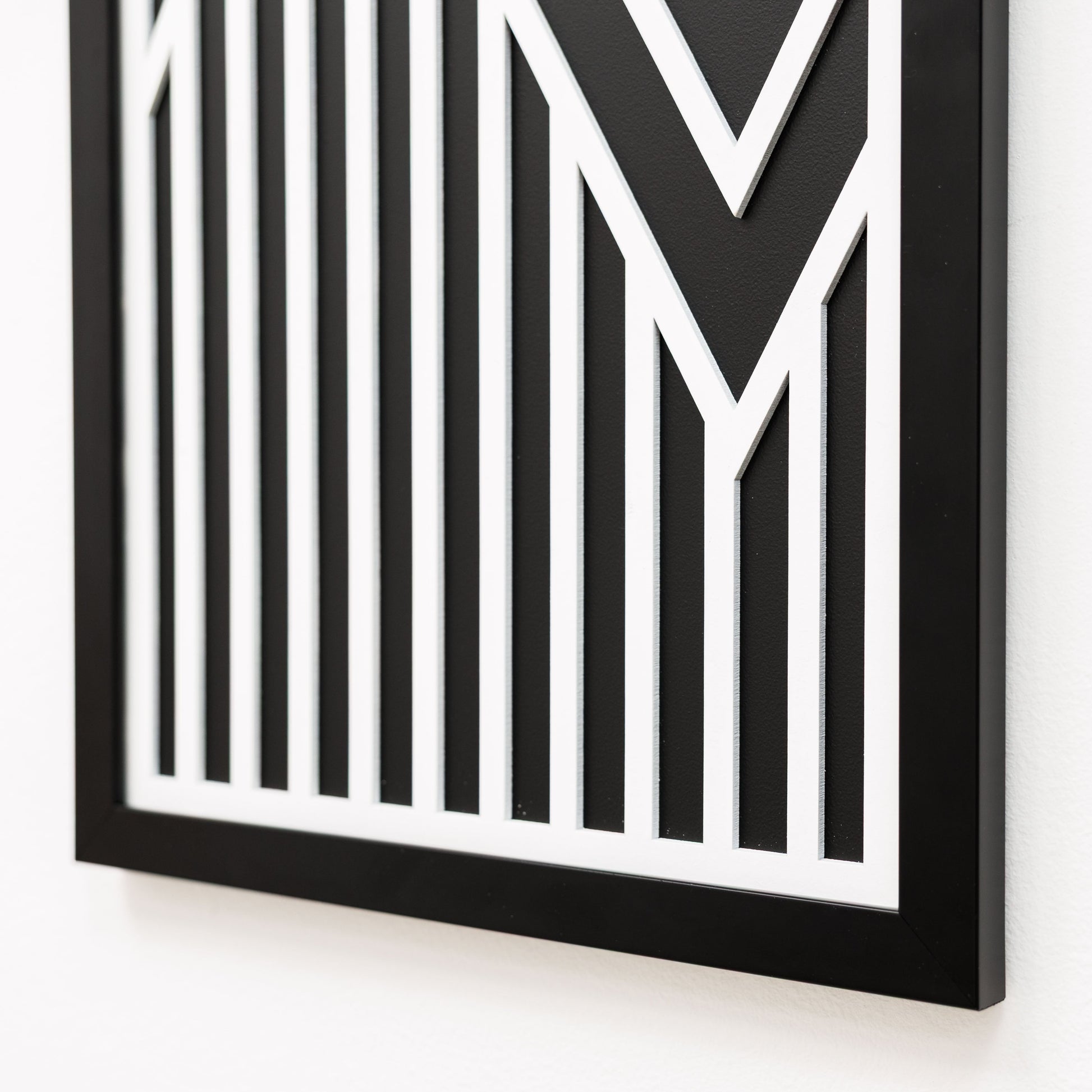 Black and white geometric patterned frame on a white background