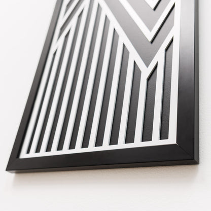 Black and white geometric wall art on a light gray background