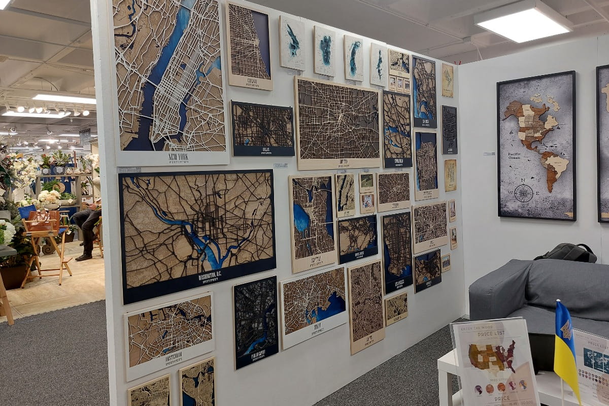 Wall with various framed maps in a store setting