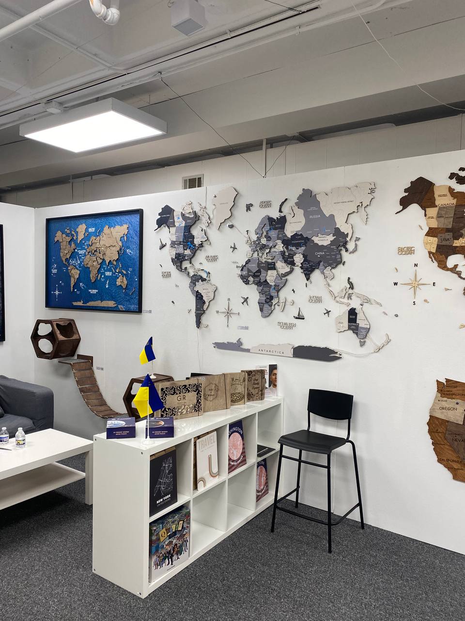 Modern office space with world map decor on the wall