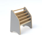 Children's wooden stool with gray base and beige steps on a white background