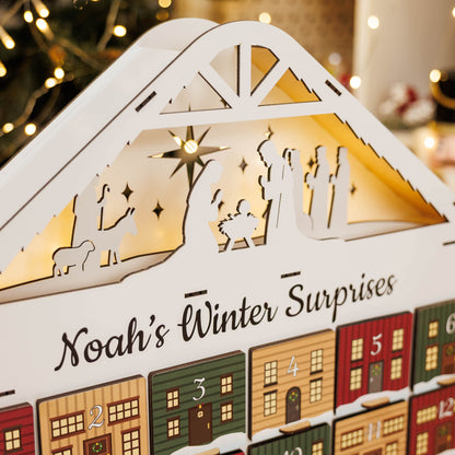 Advent calendar with nativity scene and snowy village design, featuring 'Noah's Winter Surprises'.