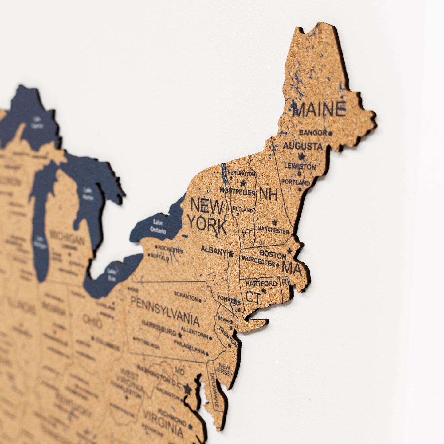 Wooden map of the northeastern United States on a white background