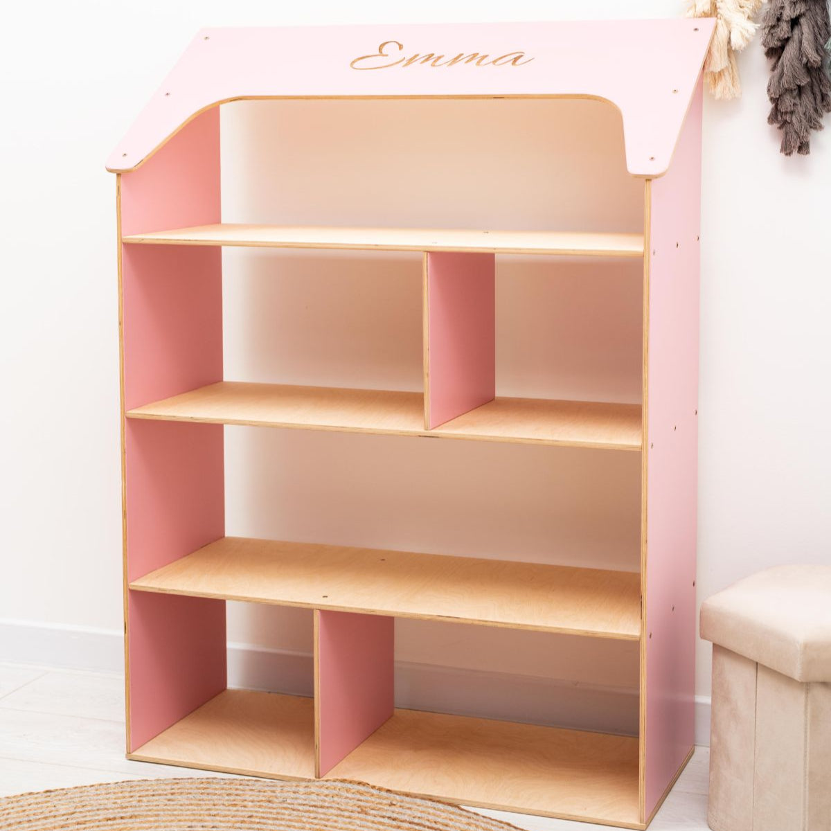 pink Montessori child-sized wooden doll house bookcase