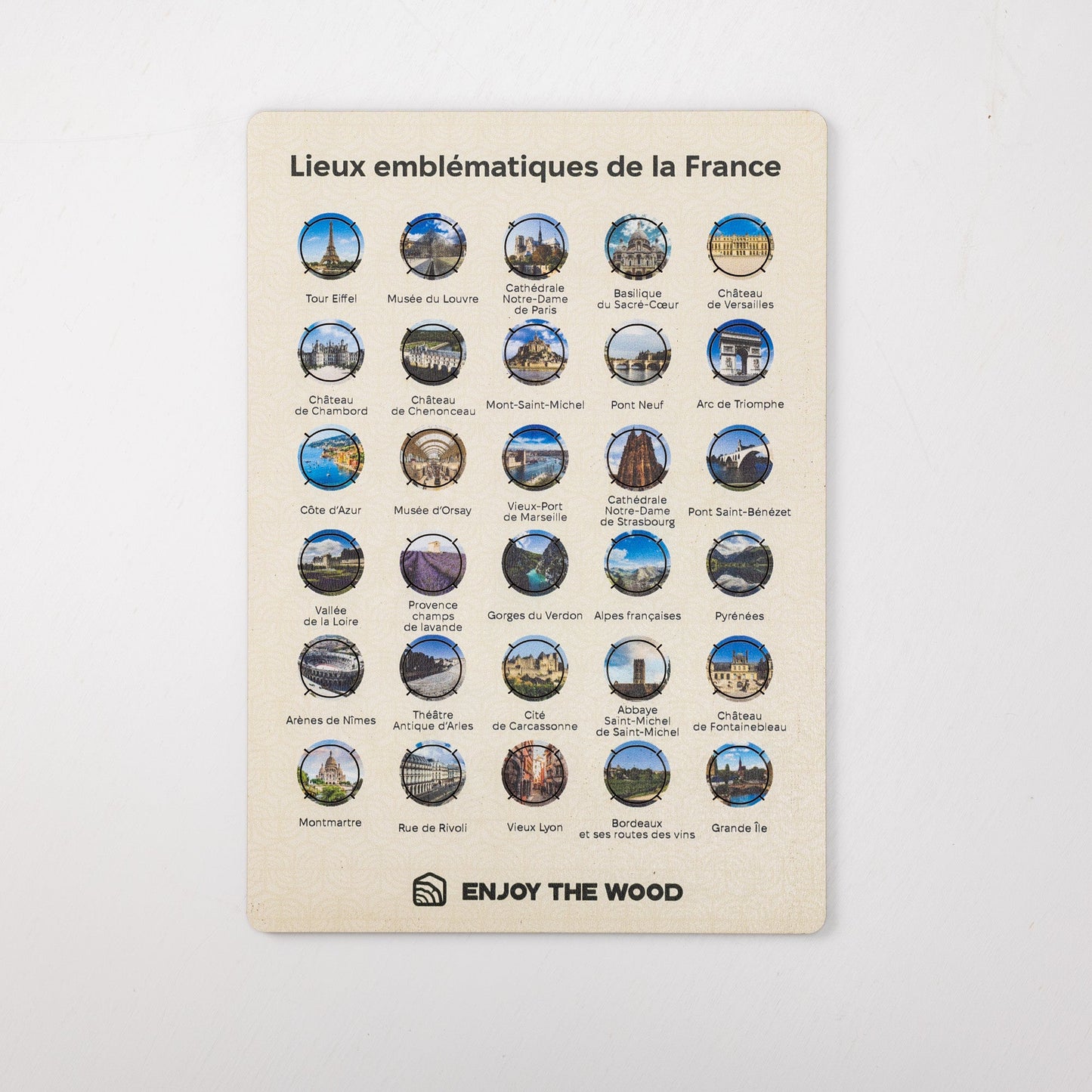Poster with emblematic locations of France and 'Enjoy the Wood' branding on a light gray background