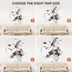 Comparison of world map wall decal sizes on a sofa with measurements.