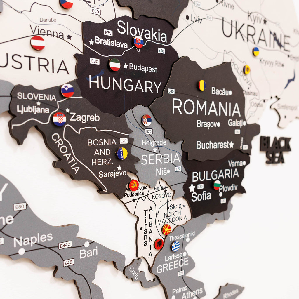 Woman interacting with a map of Europe on a wall, highlighting Poland.