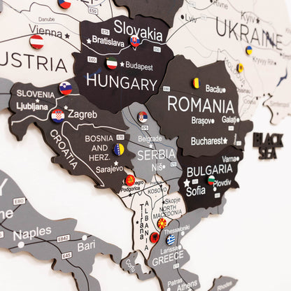 Woman interacting with a map of Europe on a wall, highlighting Poland.