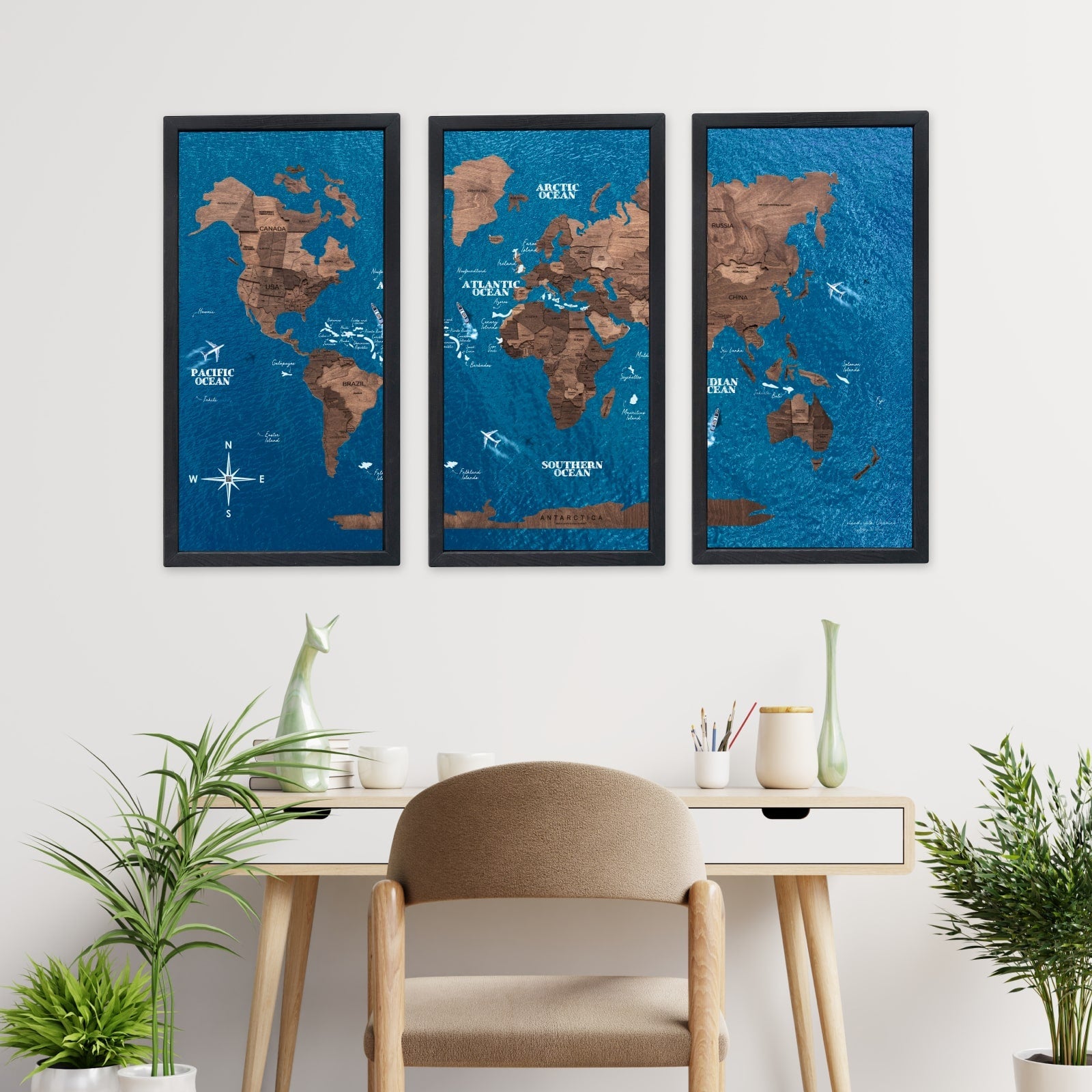 World map wall art in a modern office setting with plants and a desk.