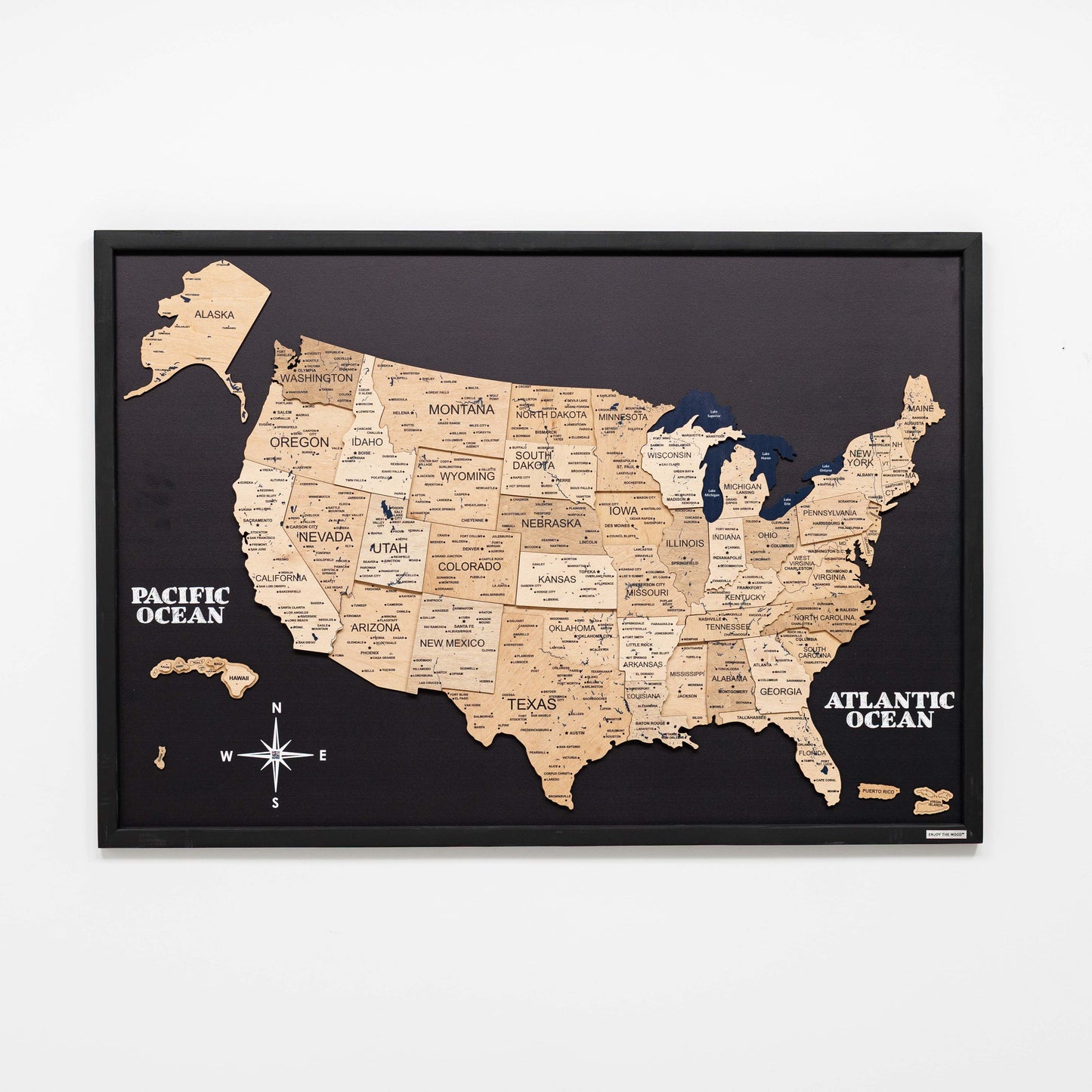 Framed map of the United States with state names on a black background