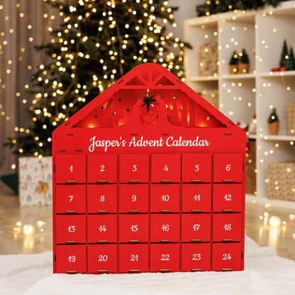 Red advent calendar with 'Jasper's Advent Calendar' text, Christmas tree and decorations in the background.
