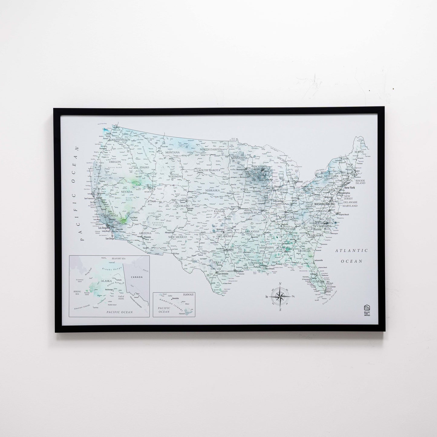 Framed map of the United States on a white wall
