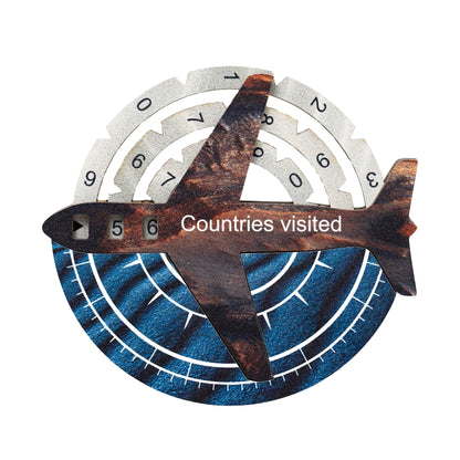 Decorative item with airplane design and 'Countries visited' text on a white background
