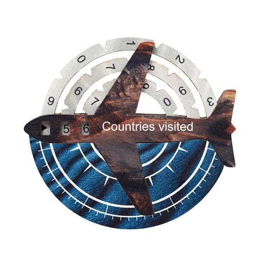 Decorative item with airplane design and 'Countries visited' text on a white background