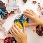 Map of Canada with a 'Countries visited' compass and hands interacting with it