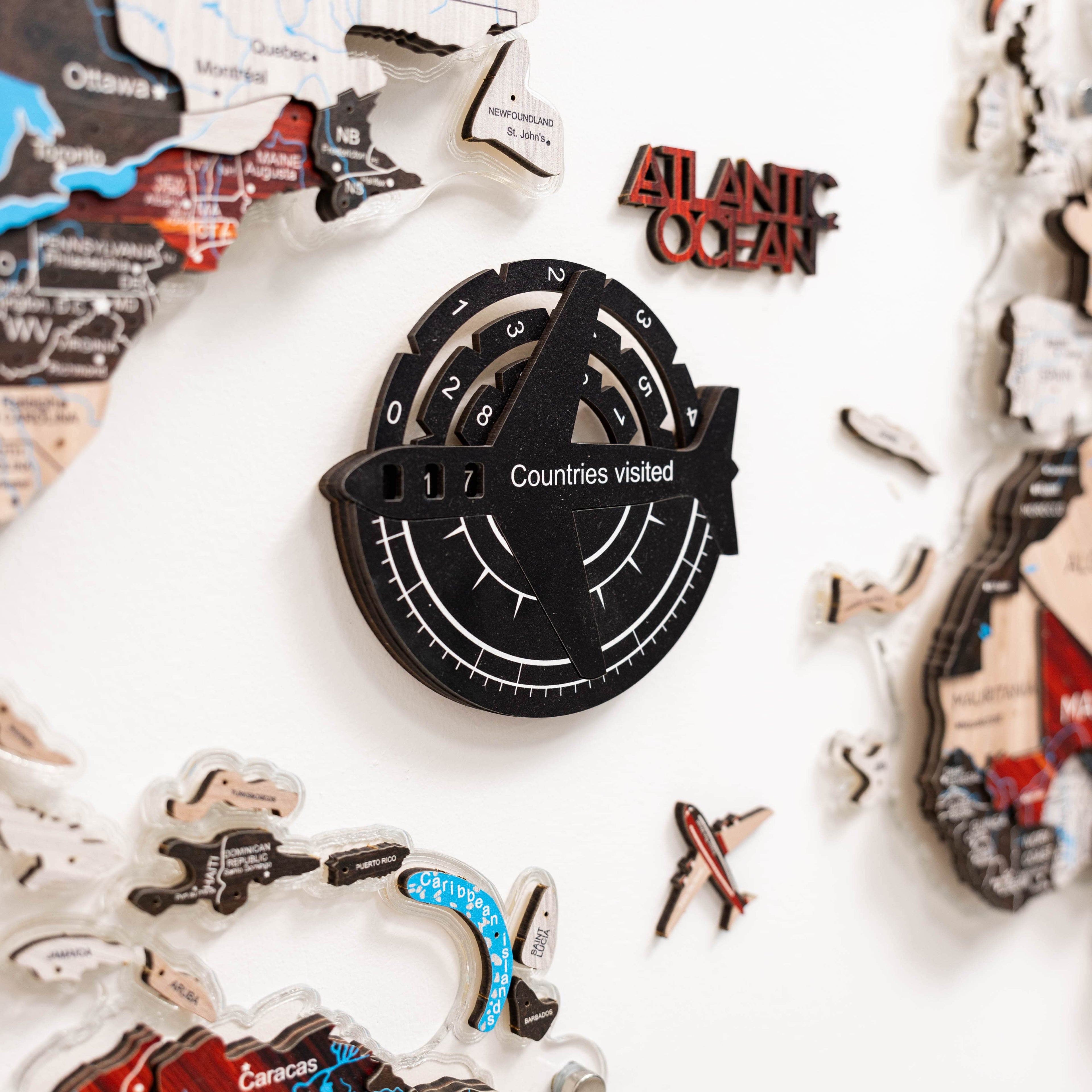 Travel-themed decorative items including a map and passport holder on a white background