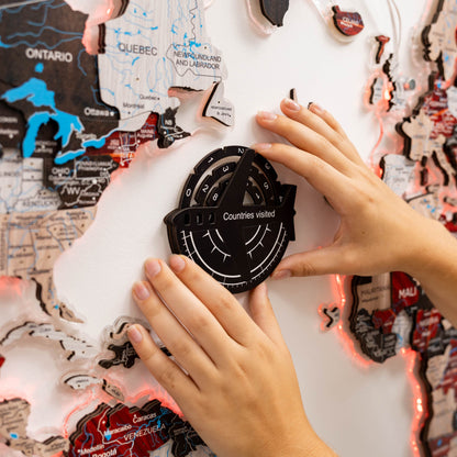 Person interacting with a world map and a 'Countries visited' tracker