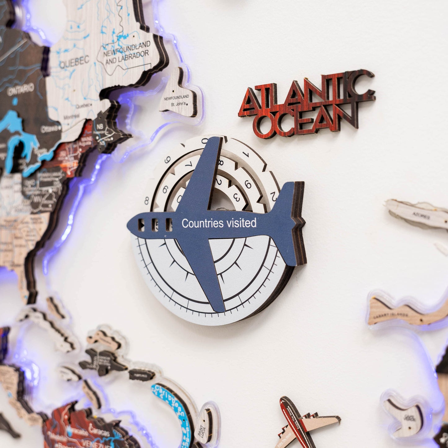 Decorative wall art with map elements and 'Atlantic Ocean' text on a white background