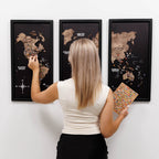Woman interacting with a world map on a wall