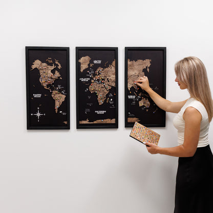 Woman interacting with a world map on a wall
