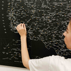 Person interacting with a map of the United States on a black background