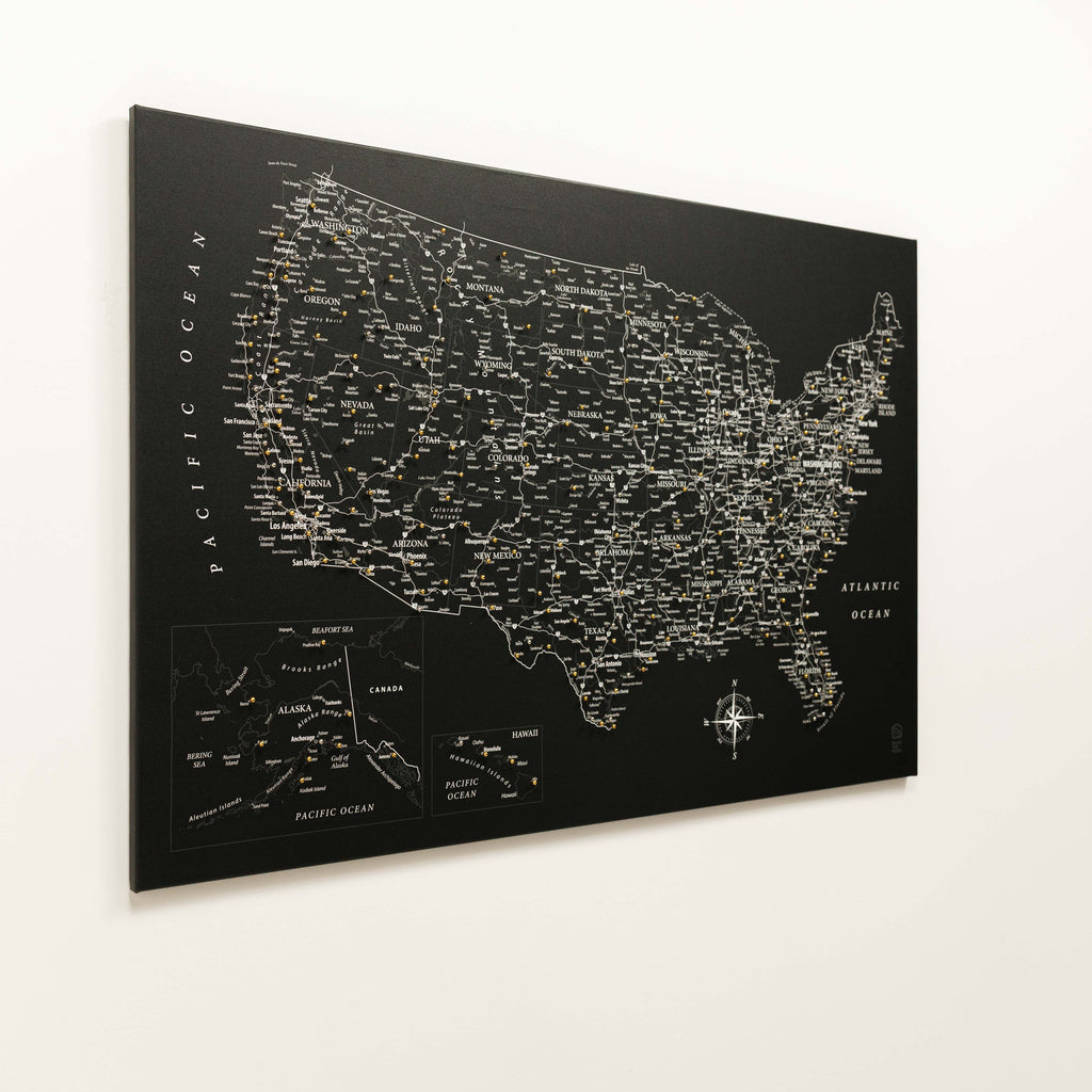 Black map of the United States with city names on a white background