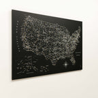 Black map of the United States with city names on a white background