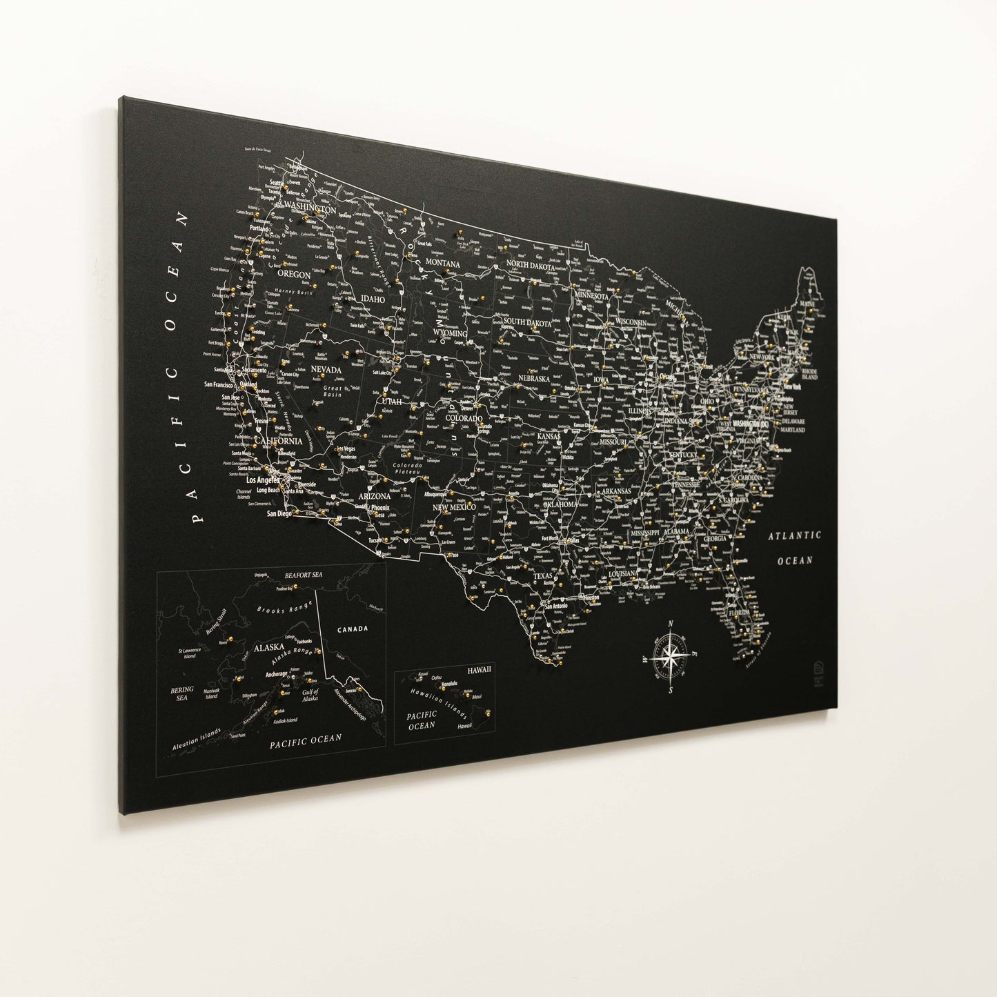 Black map of the United States with city names on a white background