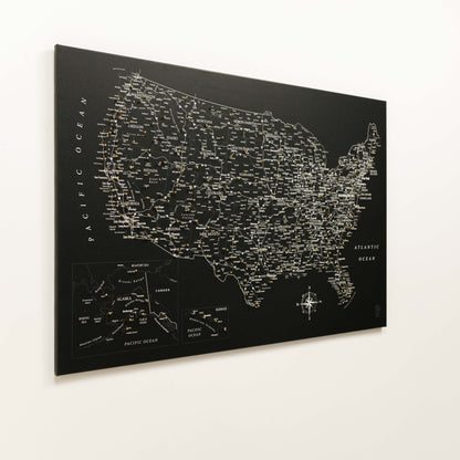 Black map of the United States with city names on a white background
