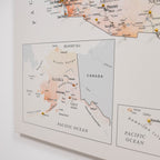 Map of Alaska with pins marking travel destinations on a light background