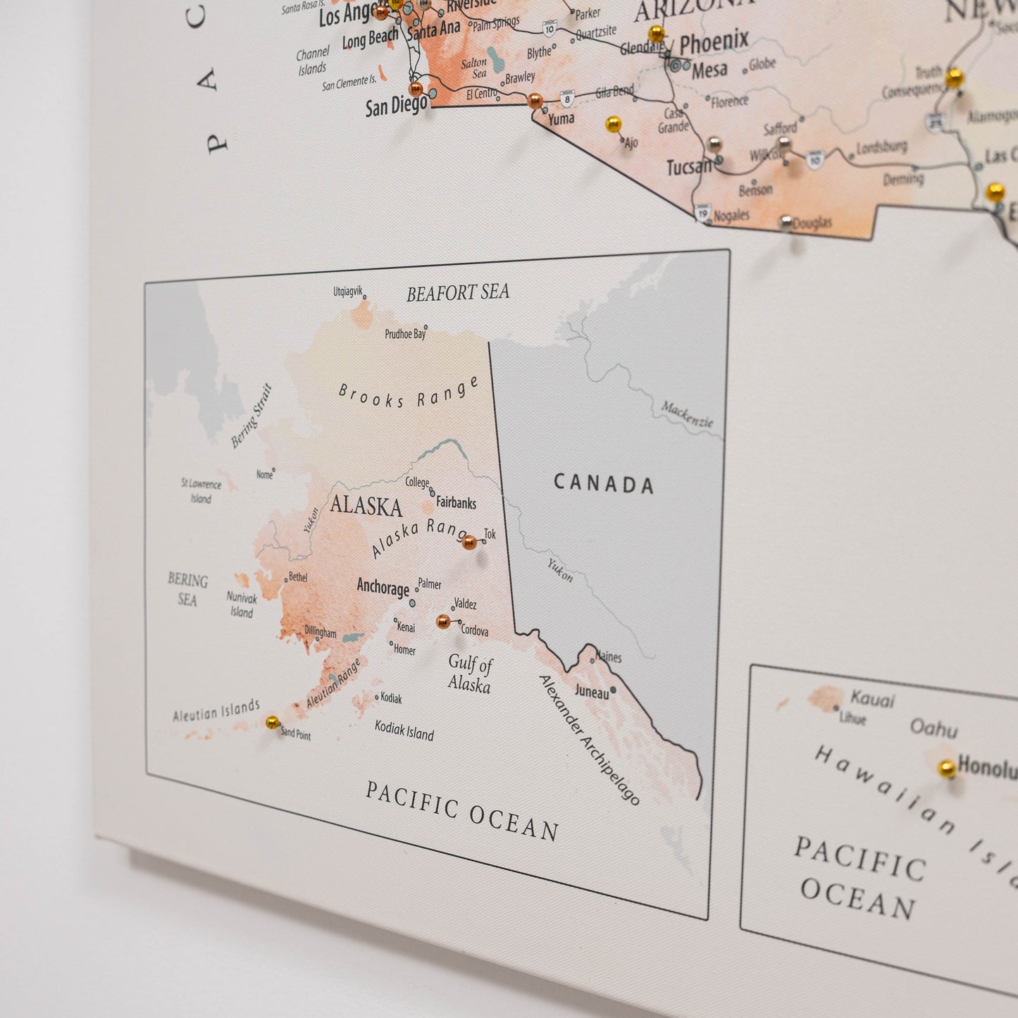 Map of Alaska with pins marking travel destinations on a light background