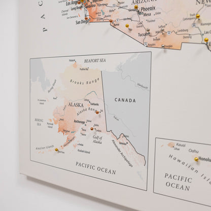 Map of Alaska with pins marking travel destinations on a light background