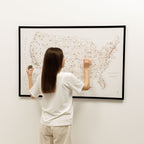 Person interacting with a map on a wall