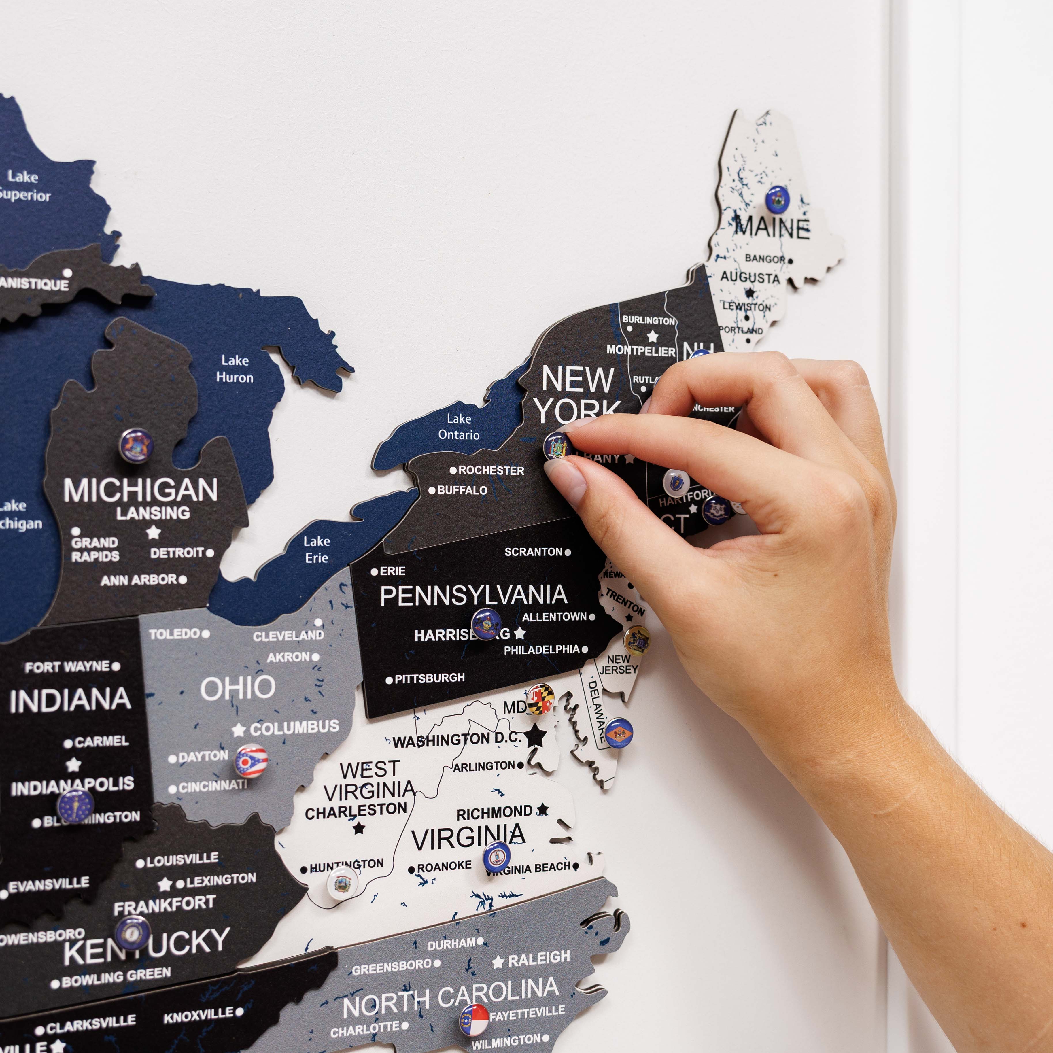 Hand interacting with a map of the United States on a white background