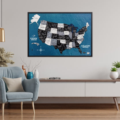 Framed map of the United States on a wall in a living room setting.